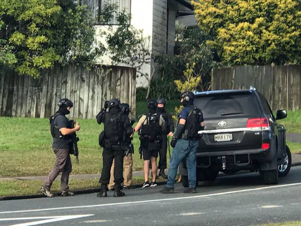 Armed police on Rena Place in West Harbour today. Photo: Anna Leask