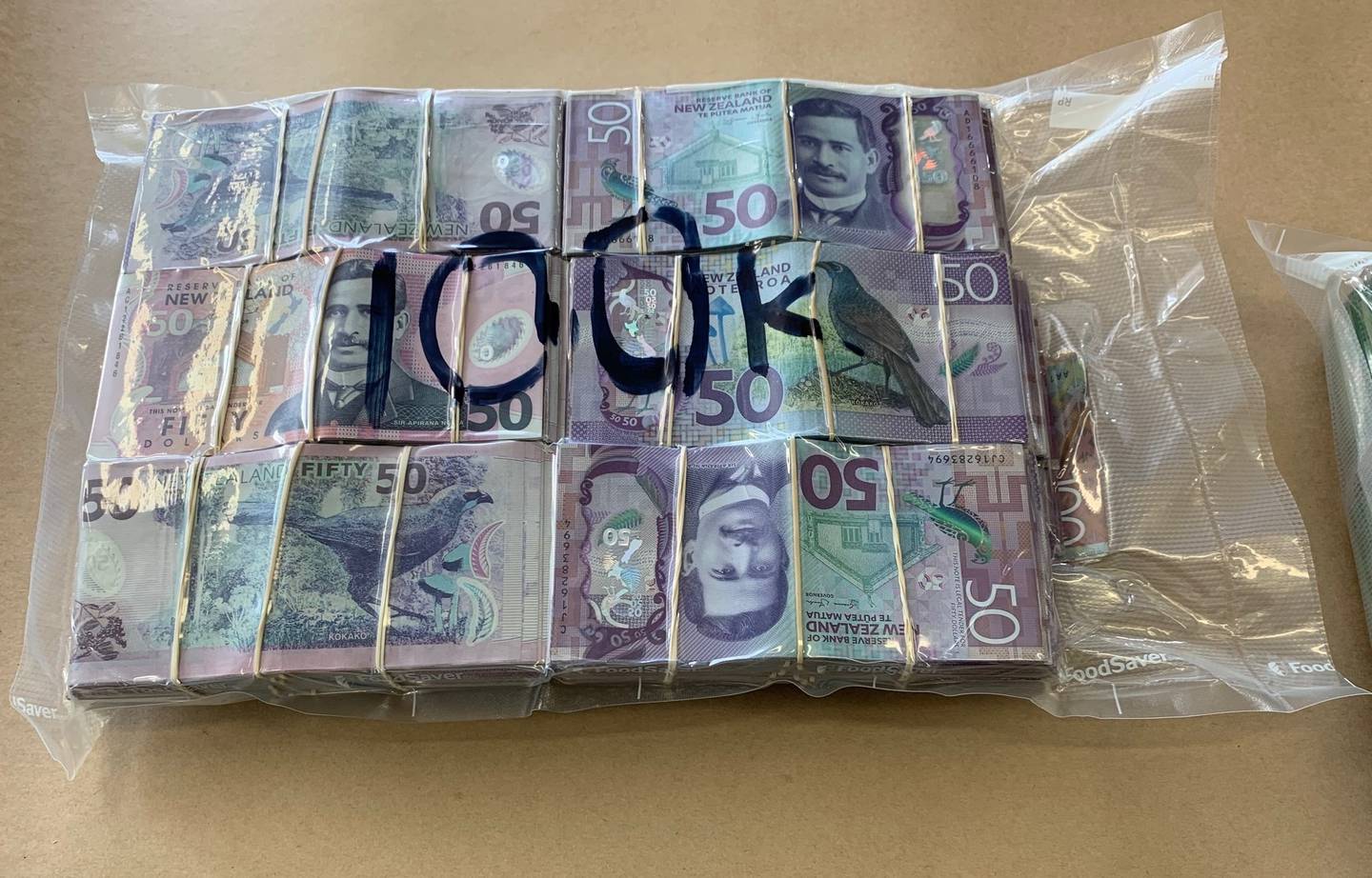 A vacuum-sealed bag holding $100,000 seized in Operation Nestegg. Photo: Supplied via NZH