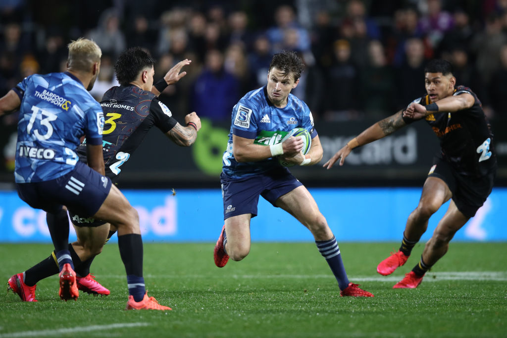 Beauden Barrett runs the ball up for the Blues against the Chiefs. Photo: Getty