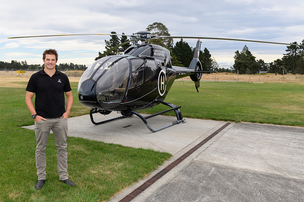 Richie McCaw poses in front of a helicopter. Photo: Getty Images