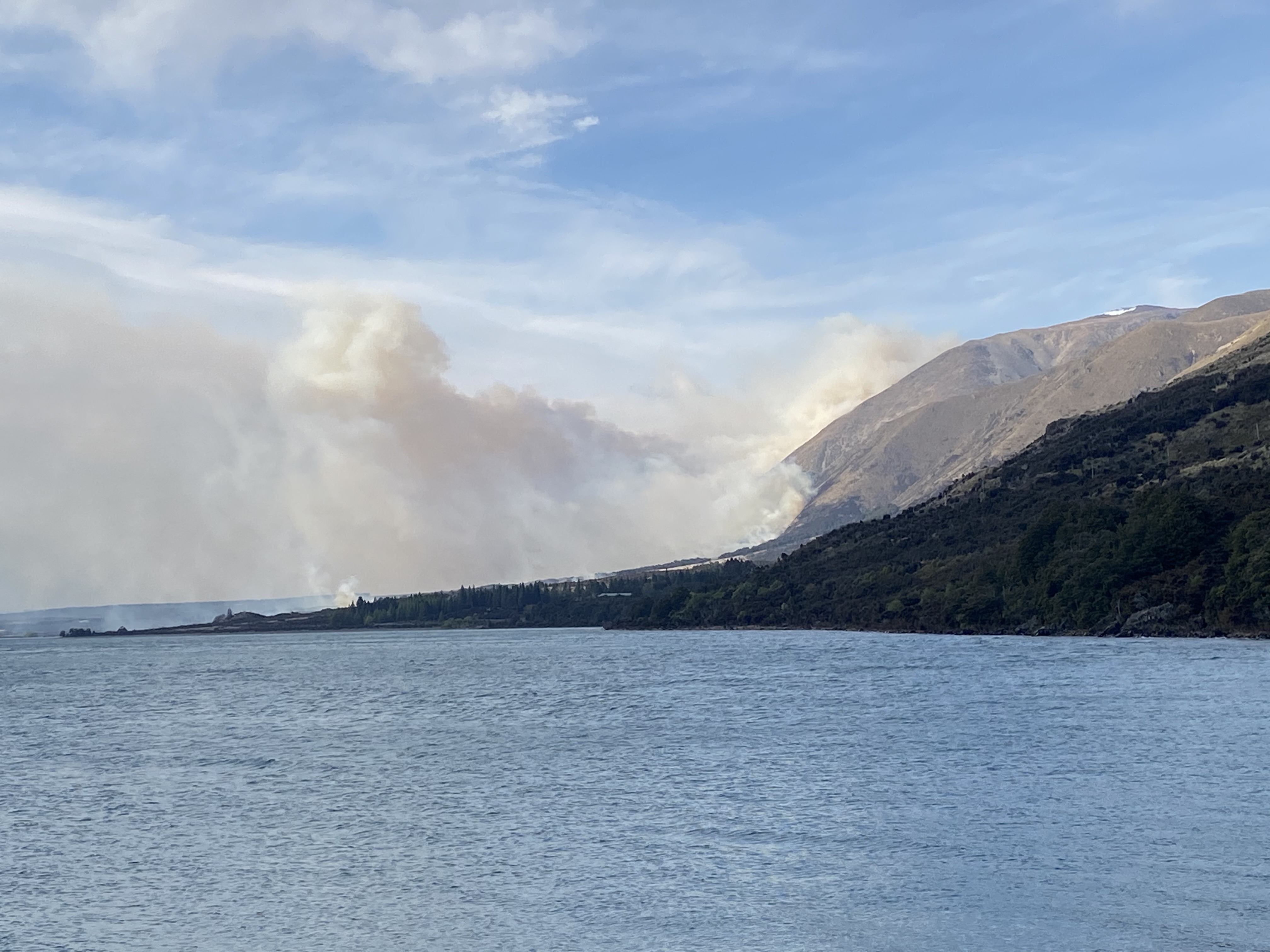 Smoke rises as the blaze continues to burn. Photo: Andy Winneke