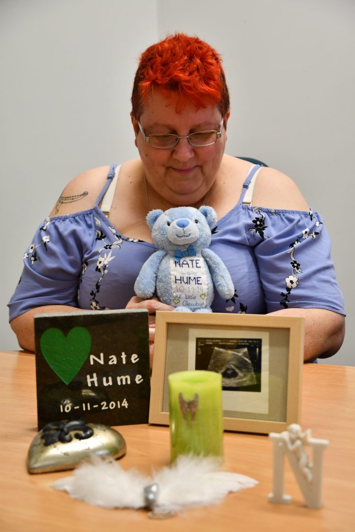 Jan McBain created a memory shelf at her home with mementoes of Nate, the baby she miscarried in...