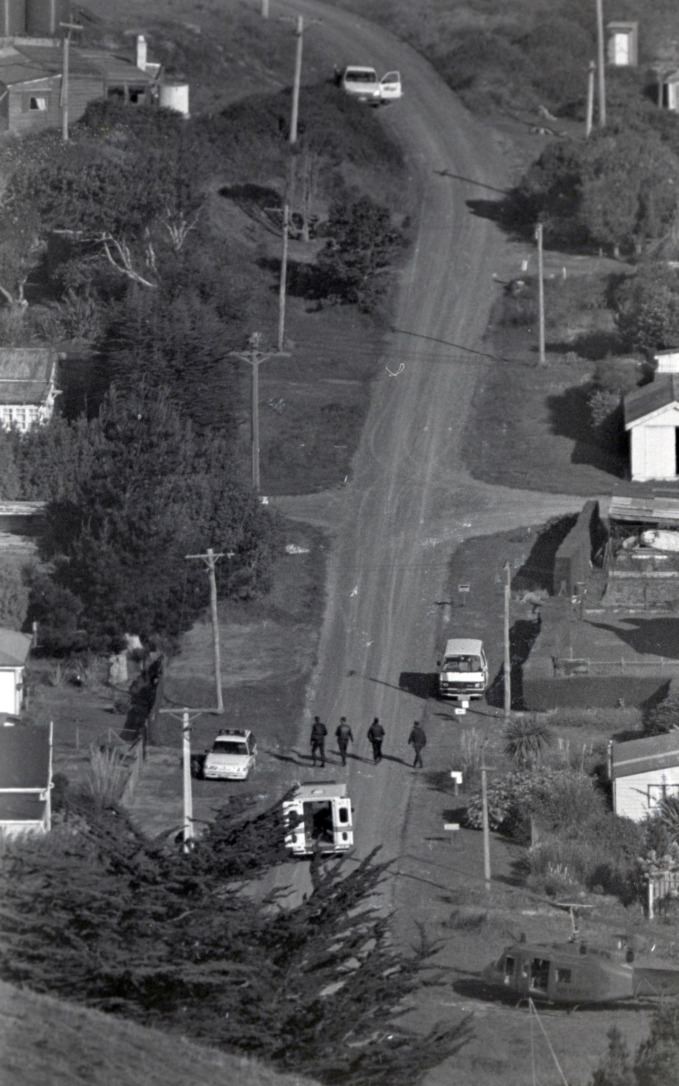 Police walk along Muri St, one of main sites of David Gray’s rampage, in Aramoana shortly after the shootings. PHOTO: ODT ARCHIVE