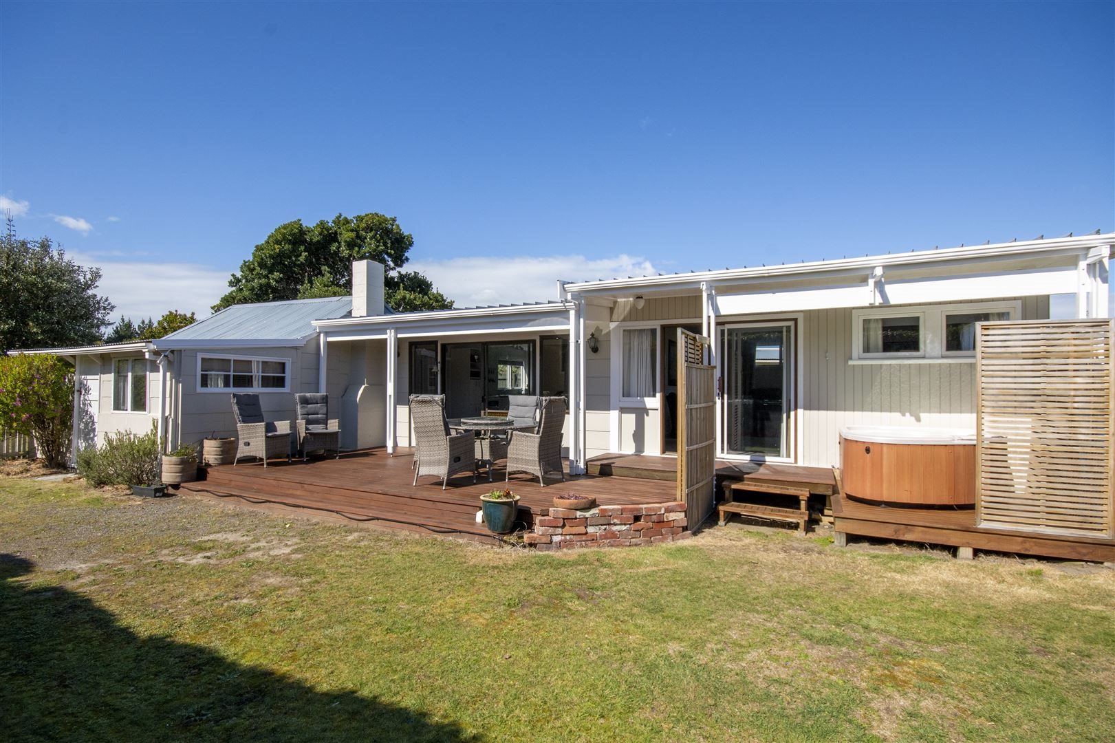 Harcourts real estate agent Lisa Tippen sold this bach at 23 Reserve Rd, Waikuku Beach, for $406...