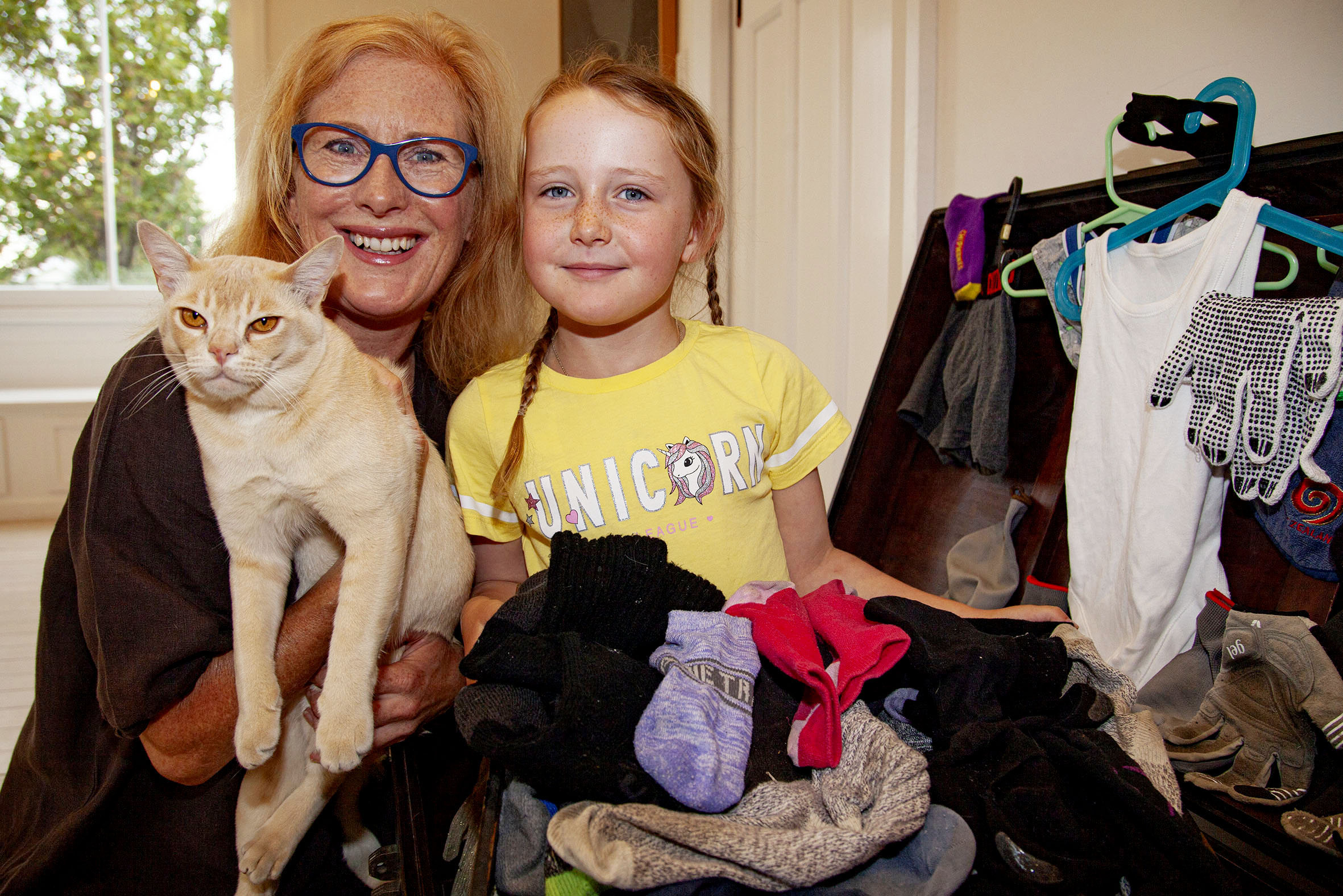 Mette Kristiansen and Harriet Kristiansen-Benge, 6, with Jasper and some of the items he has...