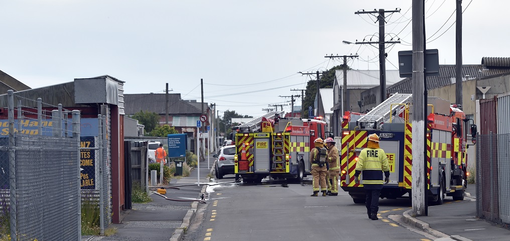 Firefighters at the scene in South Dunedin this evening. Photo: Peter McIntosh