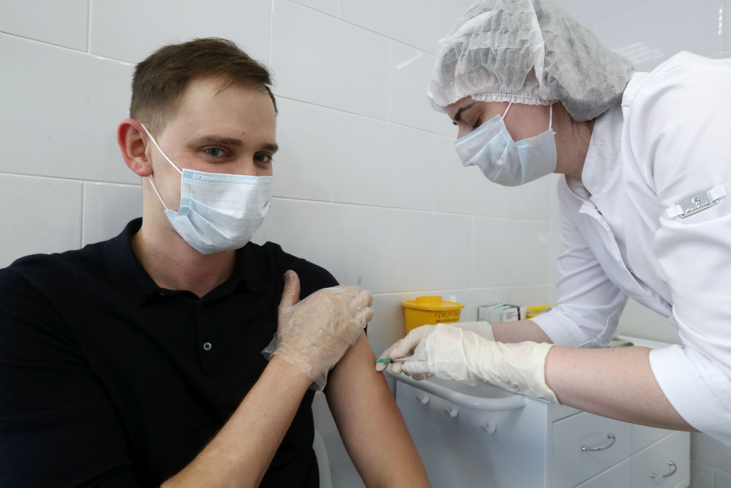 A health worker gives a Covid-19 vaccination jab at a clinic in Moscow. Photo: Getty