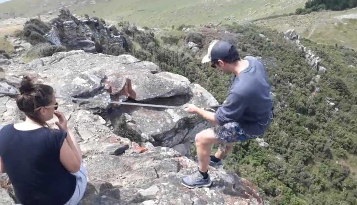 Matt Winter climbing down the cliff. Photo: Supplied