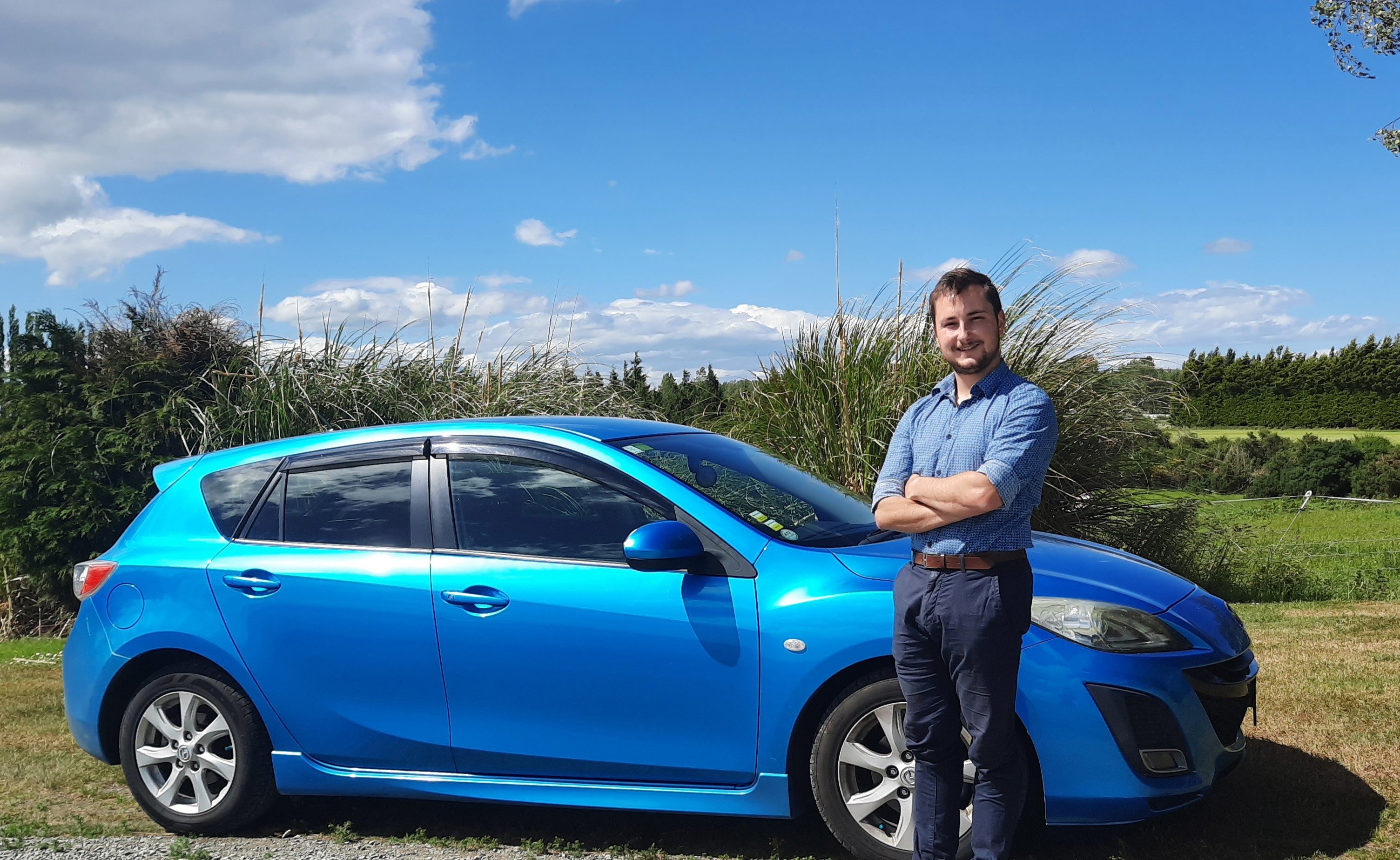 Jesse Miller with his Mazda Axela car in Lumsden, during his holiday road trip to Dunedin. PHOTO:...