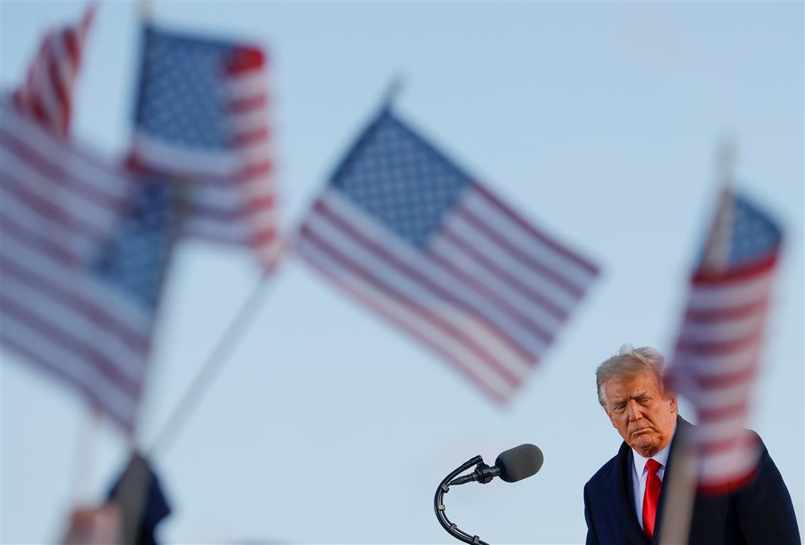 US President Donald Trump speaks at Joint Base Andrews in Maryland after leaving the White House....