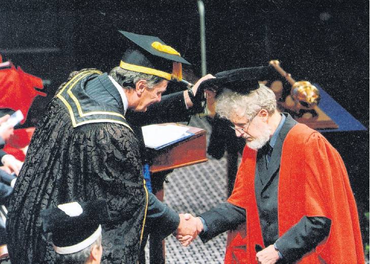 Former Otago University chancellor John Ward confers an honorary doctorate of science on Prof...