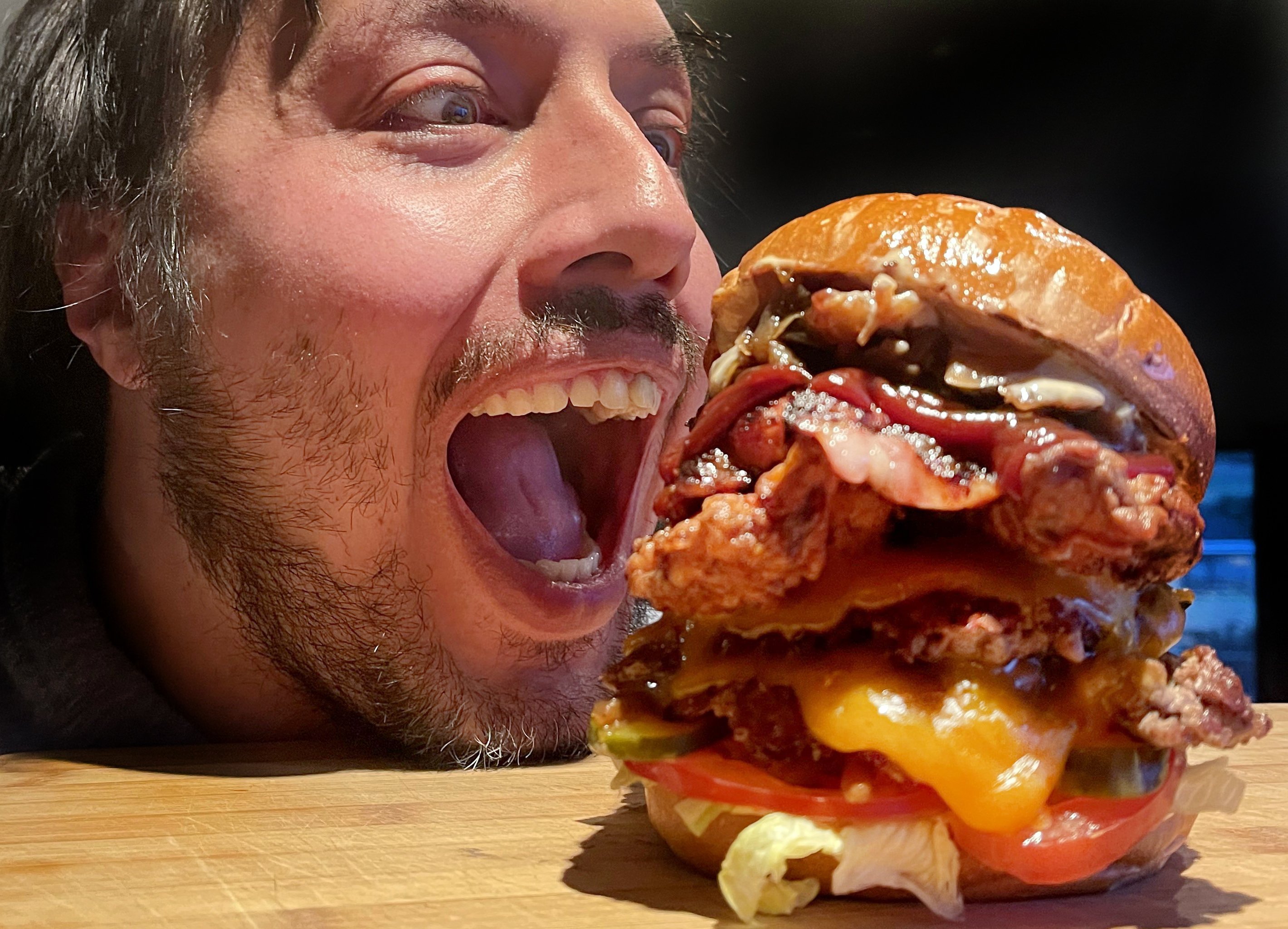 Ooga Burger founder Lydon Aoake, of Clinton, assesses one of his new Balclutha outlet’s offerings...