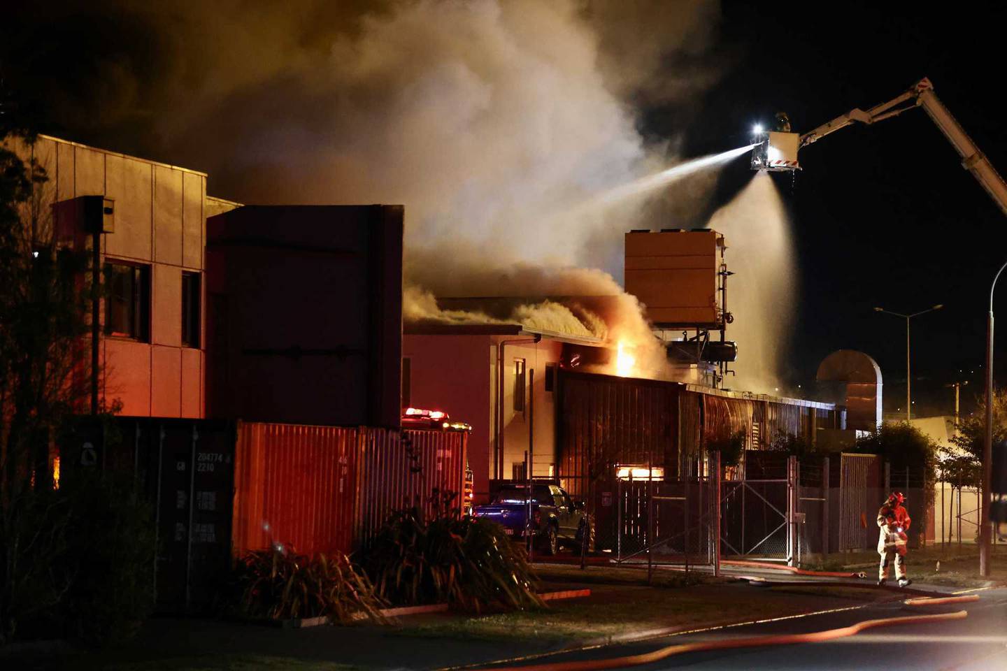 Fire crews battle a large factory blaze in Christchurch. Photo: George Heard