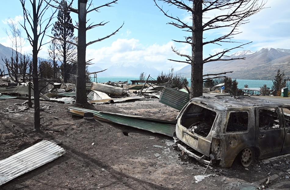 Cars were reduced to burnt-out husks by the fire as it spread through Ohau Village. PHOTO: CRAIG...