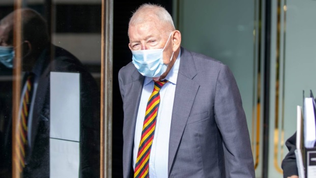 Sir Ron Brierley leaving a Sydney court after admitting possession of child sex abuse materials....