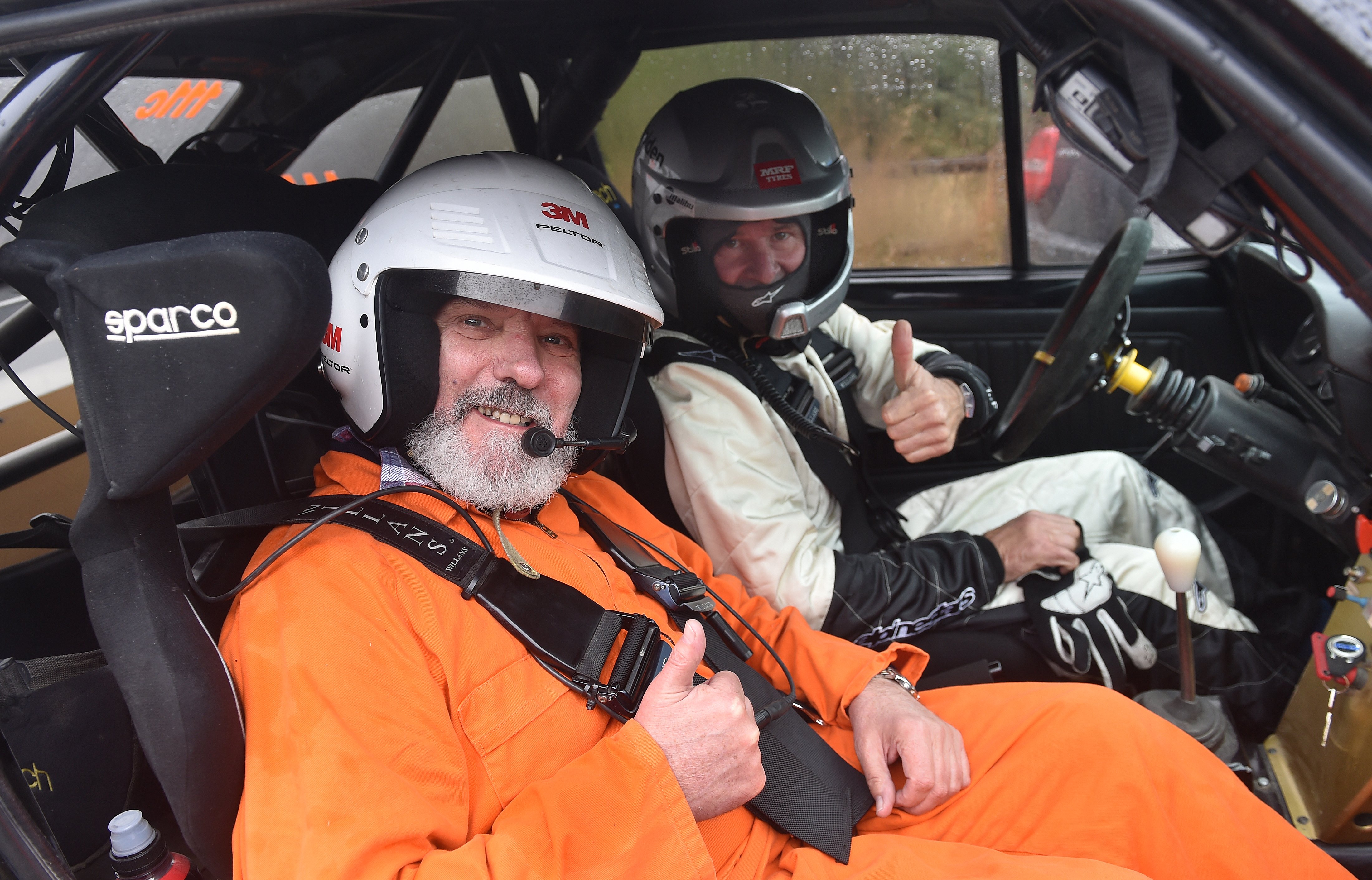 Aaron Slight (right) and Gary Newton give a thumbs-up before a run through Flagstaff Forest...