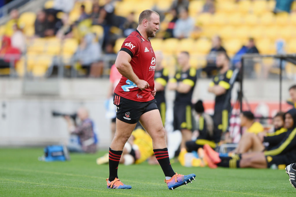 Joe Moody leaves the field with an injury during the match between the Crusaders and the...