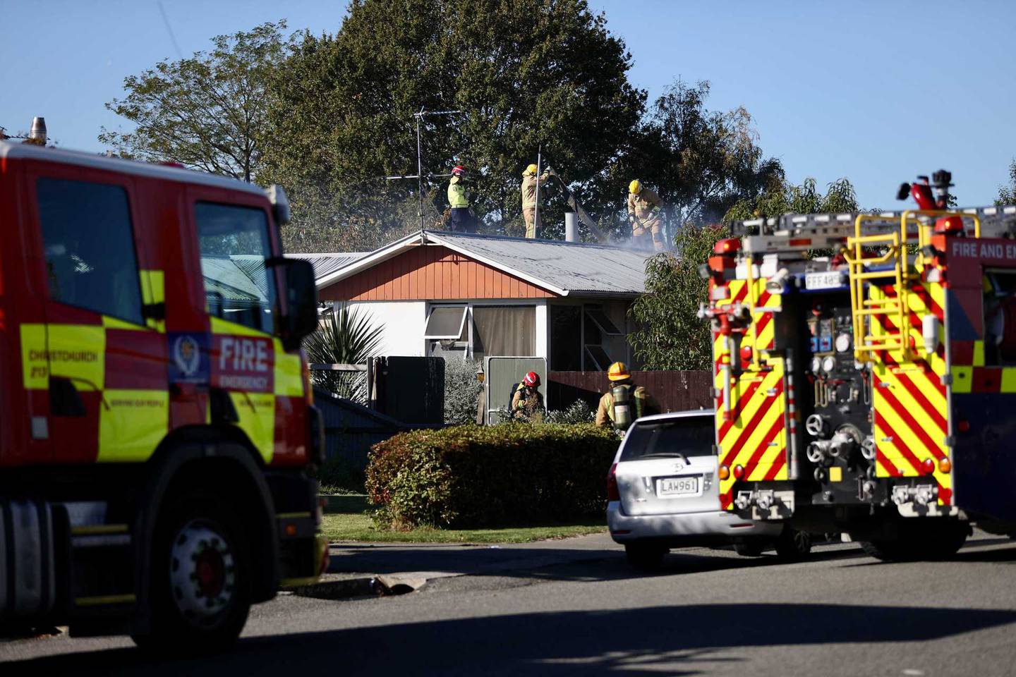 Fire crews battling the house fire in Kaiapoi. Photo: George Heard