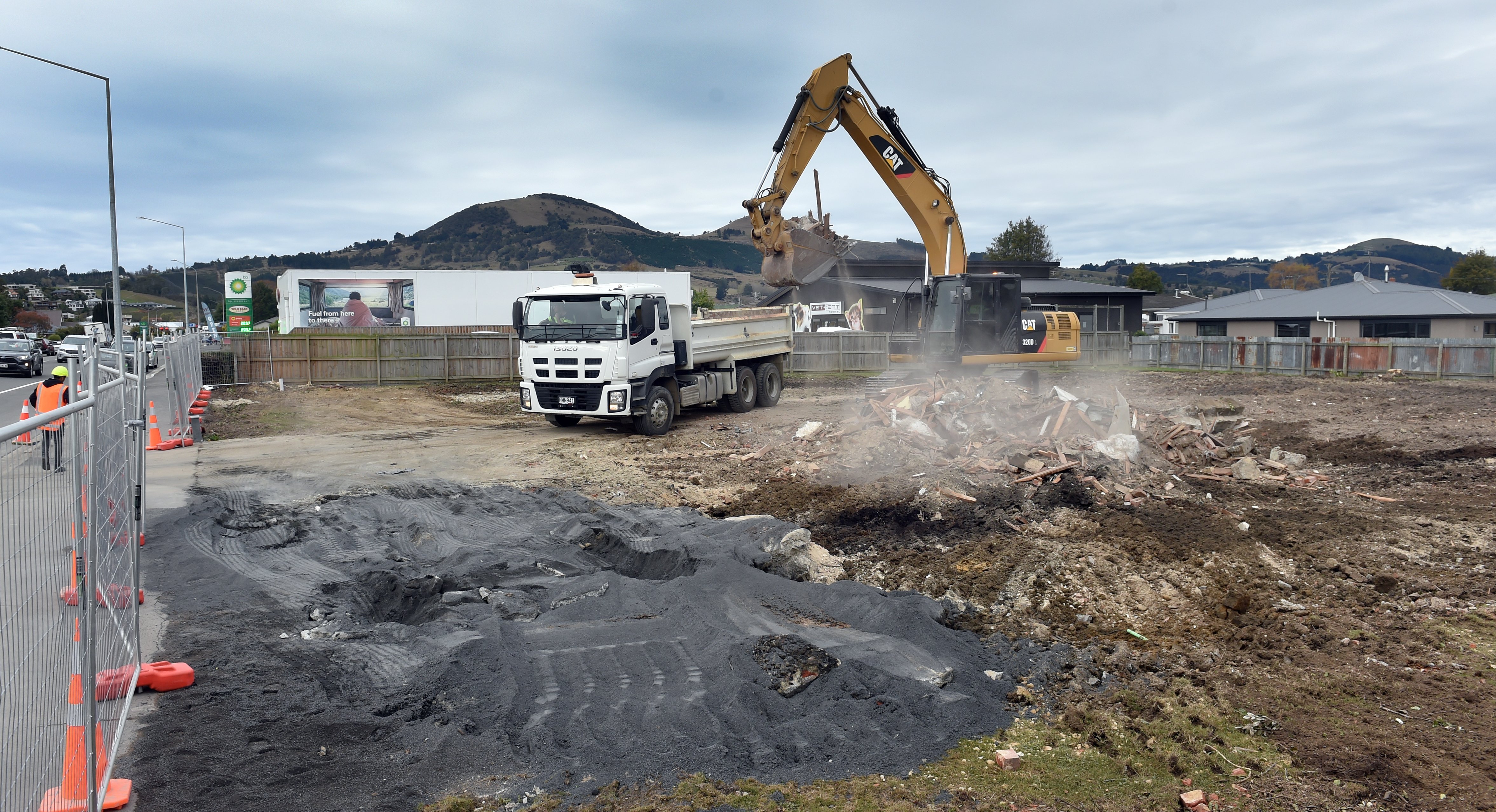 A digger removes the remains. PHOTO: PETER MCINTOSH