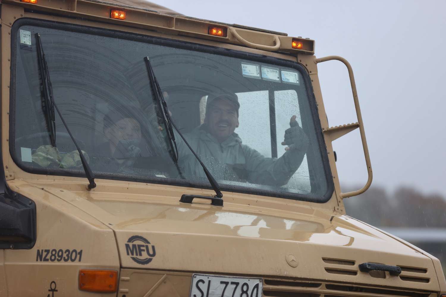 Michael McLintock and son after being evacuated from the Selwyn Huts. Photo: George Heard