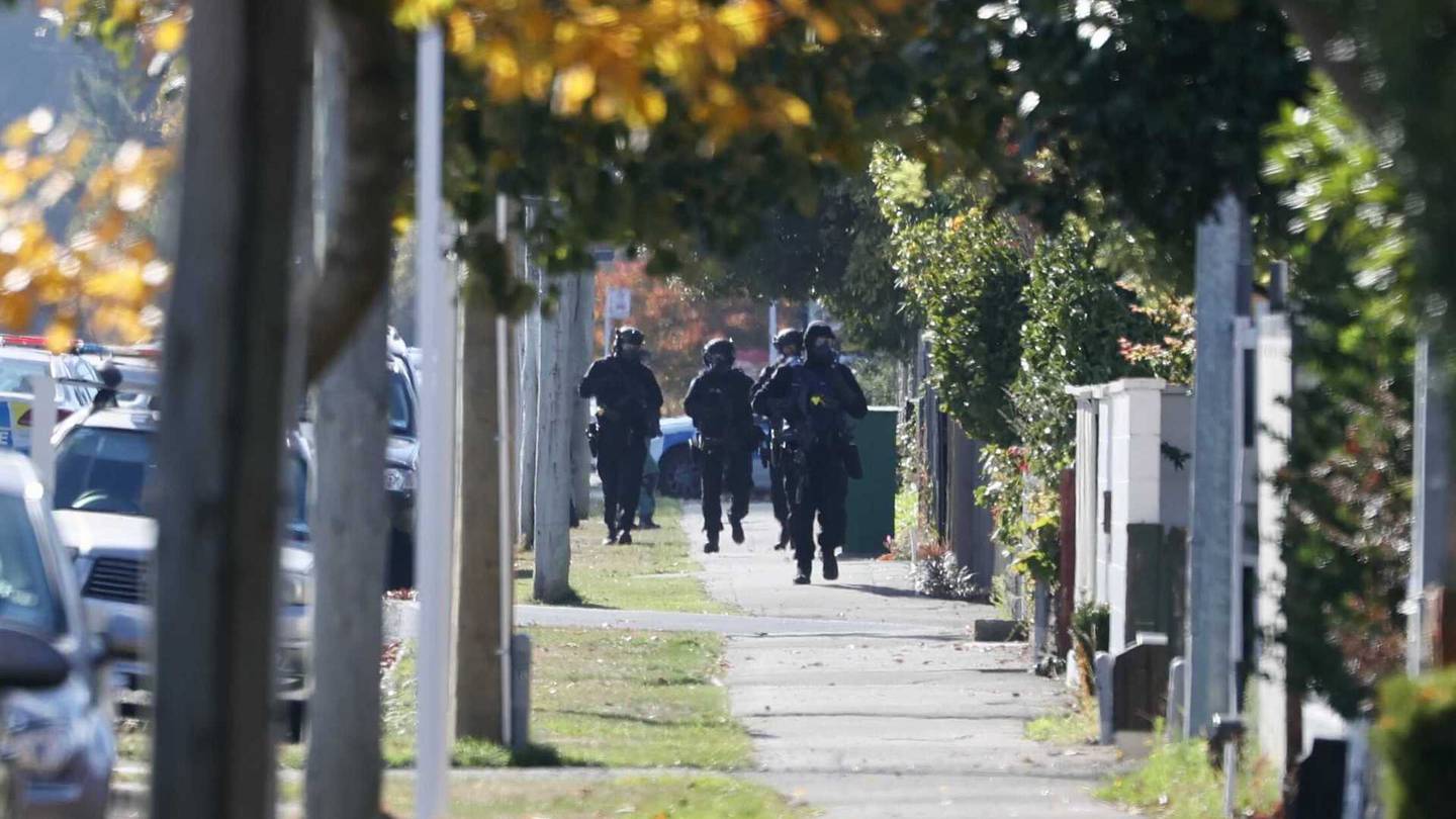 Armed police converged on a Christchurch street earlier today. Photo: George Heard