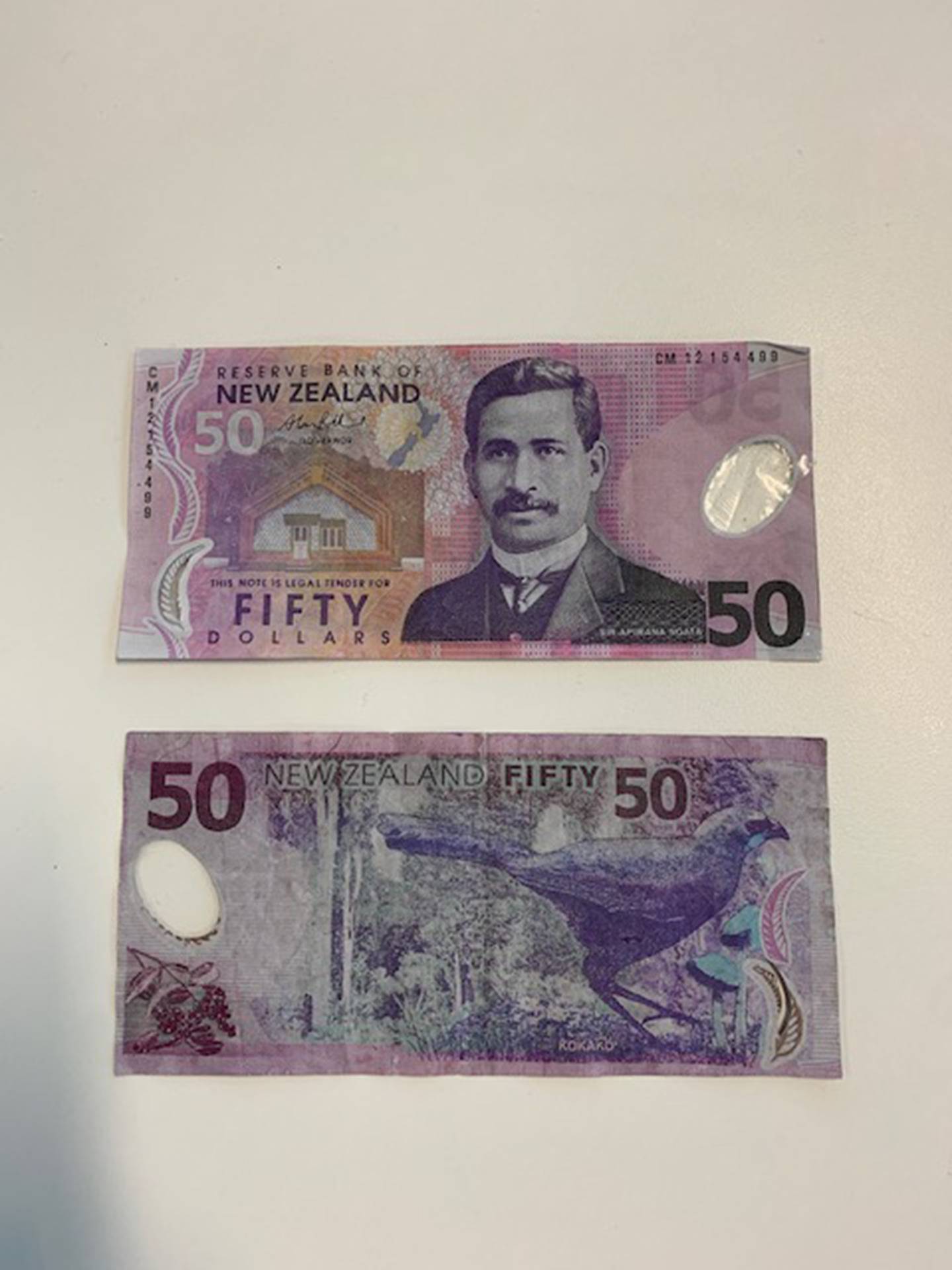 Nicholas Parker's fake $50 notes (pictured) were described by police as closely resembling real ...