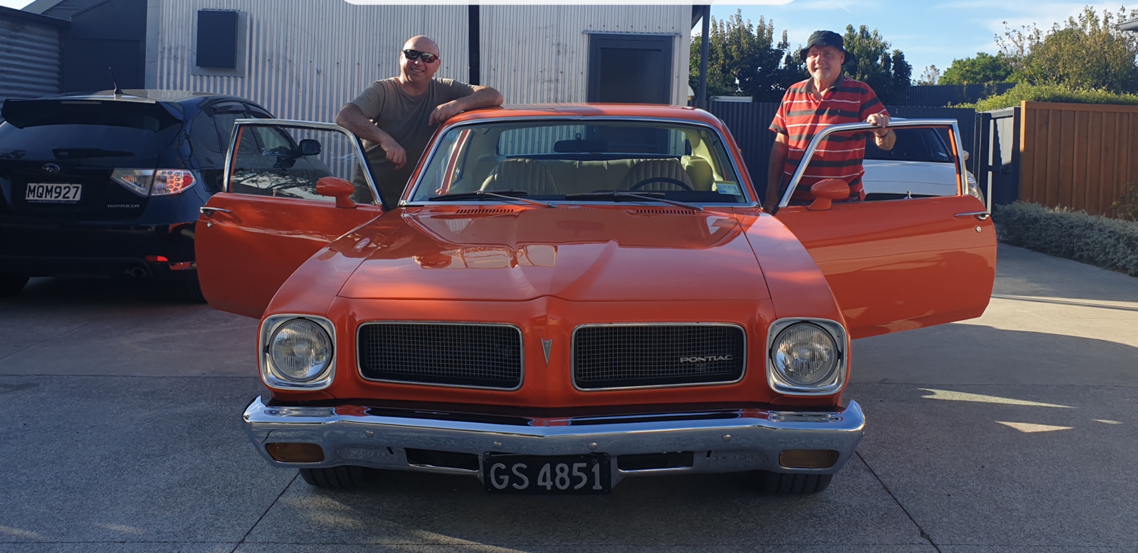 Reuben Lilly (left) and his father, Mike, with the Pontiac that is now back in the family for...