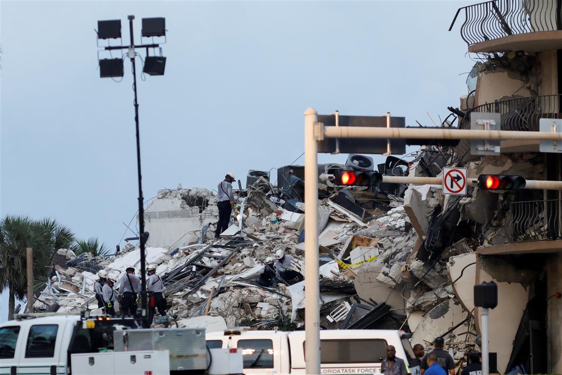 Emergency crews at the scene of the collapsed building in Surfside, near Miami Beach. Photo: Reuters