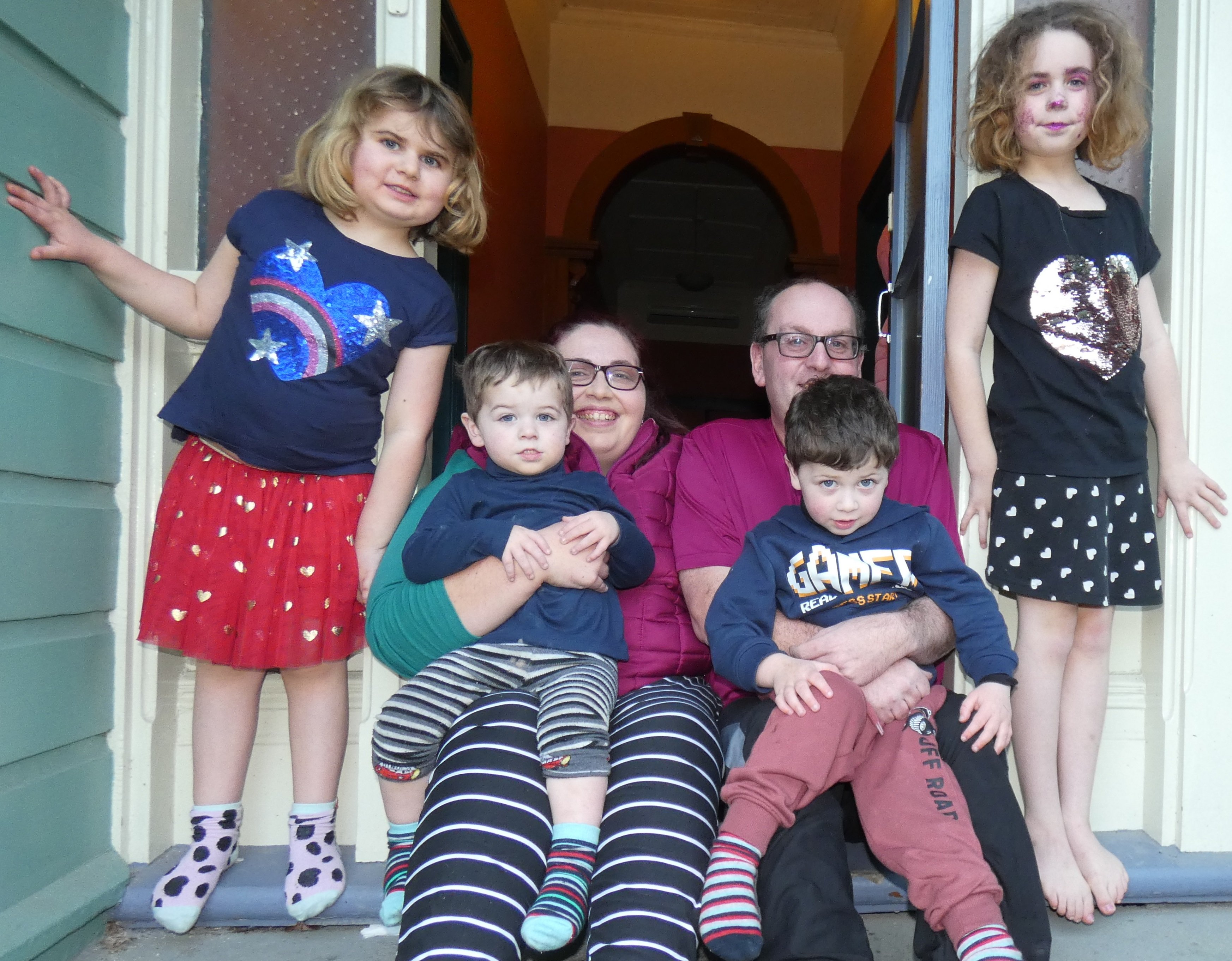 Sarah and Jason McCook, with their children (from left) Isabel (6), Cooper (2), Connor (4) and...