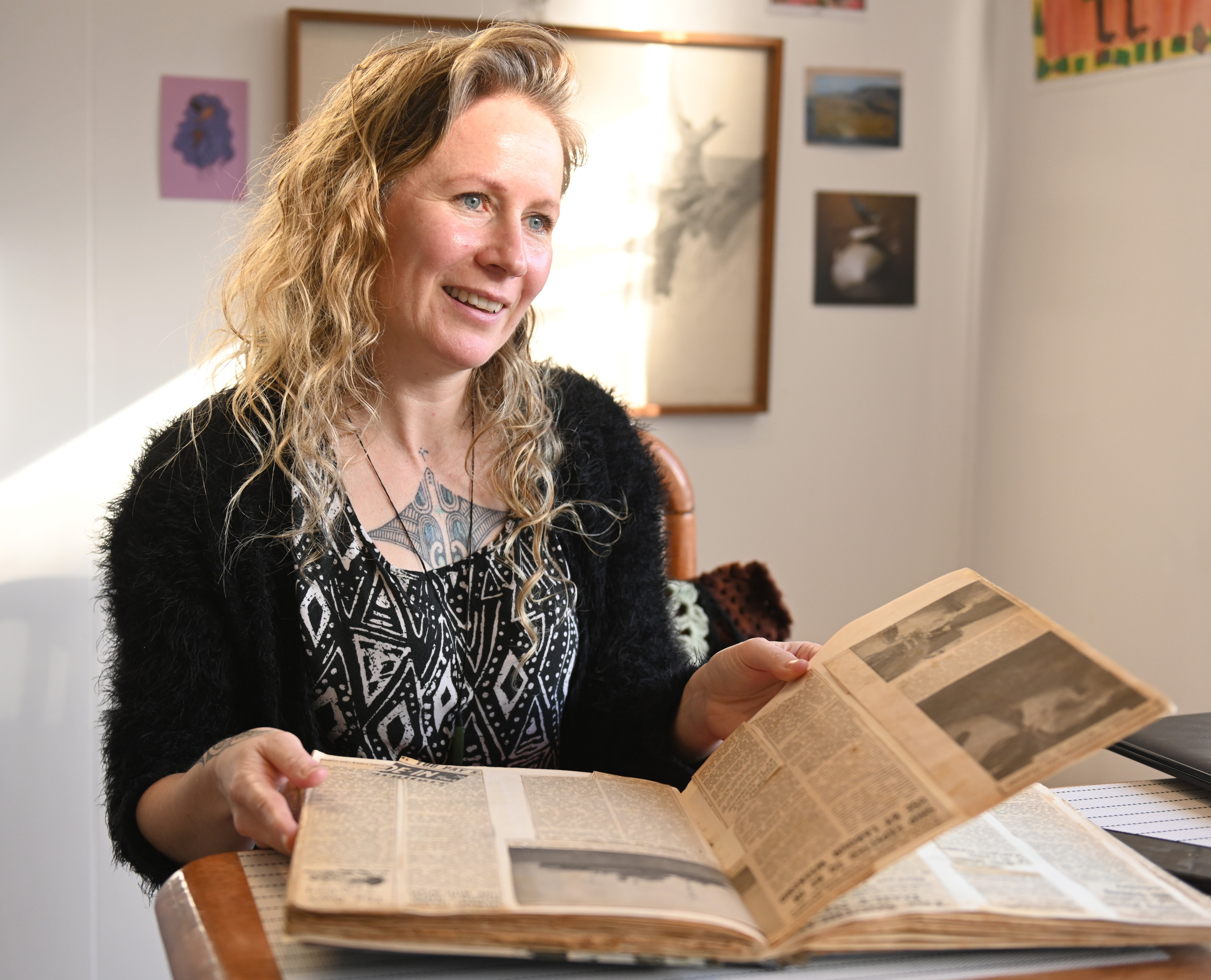 Author Becky Manawatu flicks through her nana’s scrapbook.  PHOTO: LINDA ROBERTSON