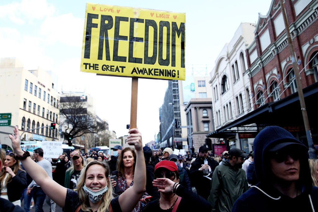 Participants march down George St in Sydney during an anti-lockdown protest on Saturday. Photo:...