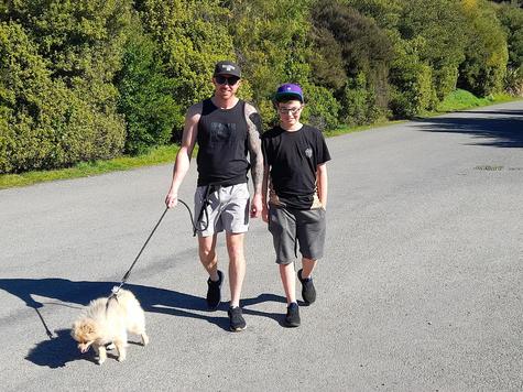 Joel (left) and son Cohen pay a visit to Halswell Quarry with pooch Peyton. Photo: Fiona Ellis