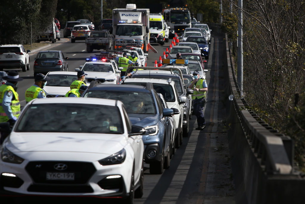 Police conduct roadside checks with drivers heading towards the Anzac Bridge in Sydney over the...