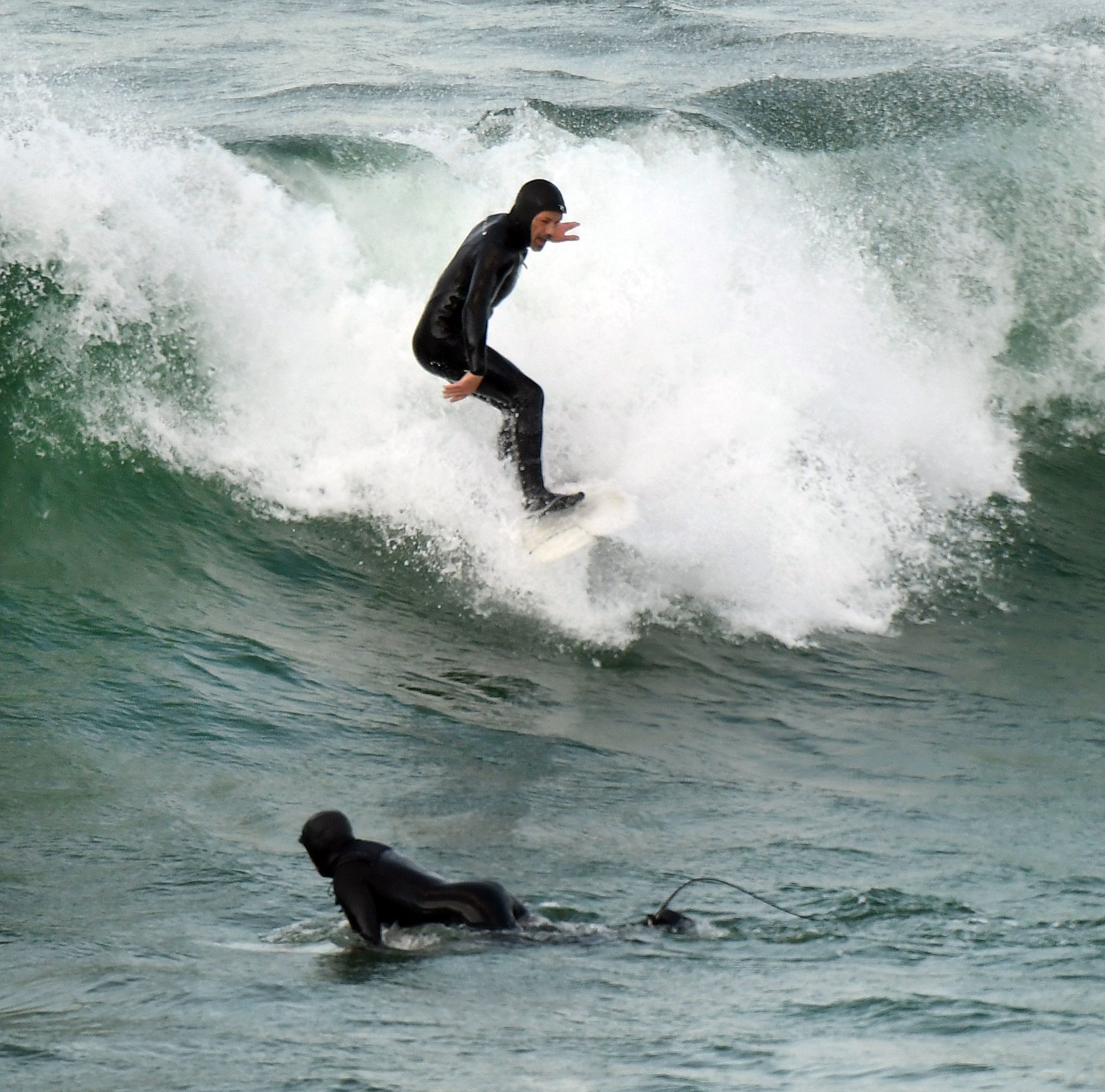 Surfers breach lockdown conditions to catch the waves at Blackhead Beach. Any activity that would...