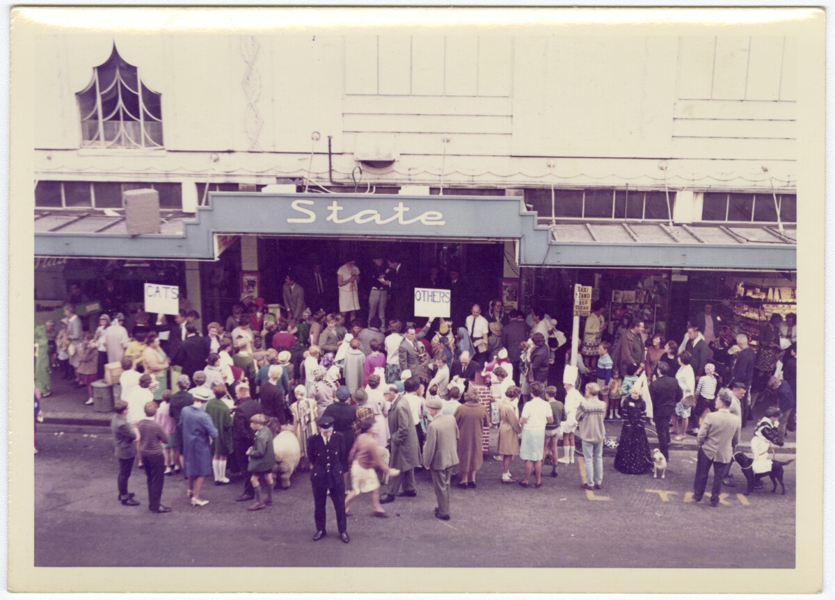 Movie-goers queue for a ticket outside the State Cinema in Colombo St. If you have historic...