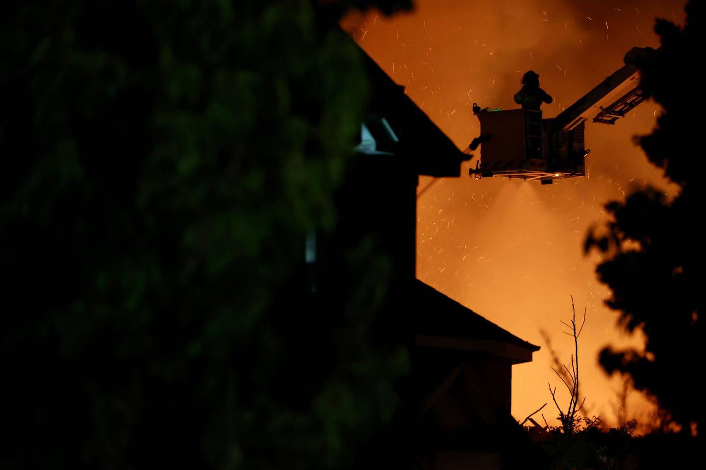 Firefighters working to put the fire out at Antonio Hall. Photo: George Heard