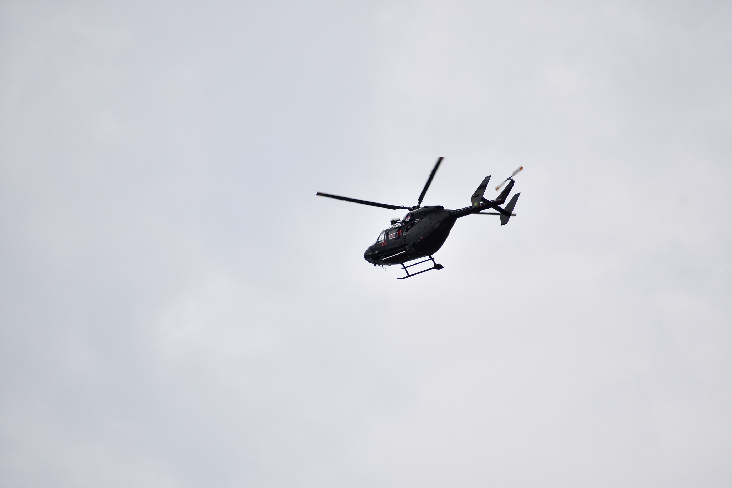 A helicopter takes part in the operation at Bluff Harbour today. Photo: Laura Smith