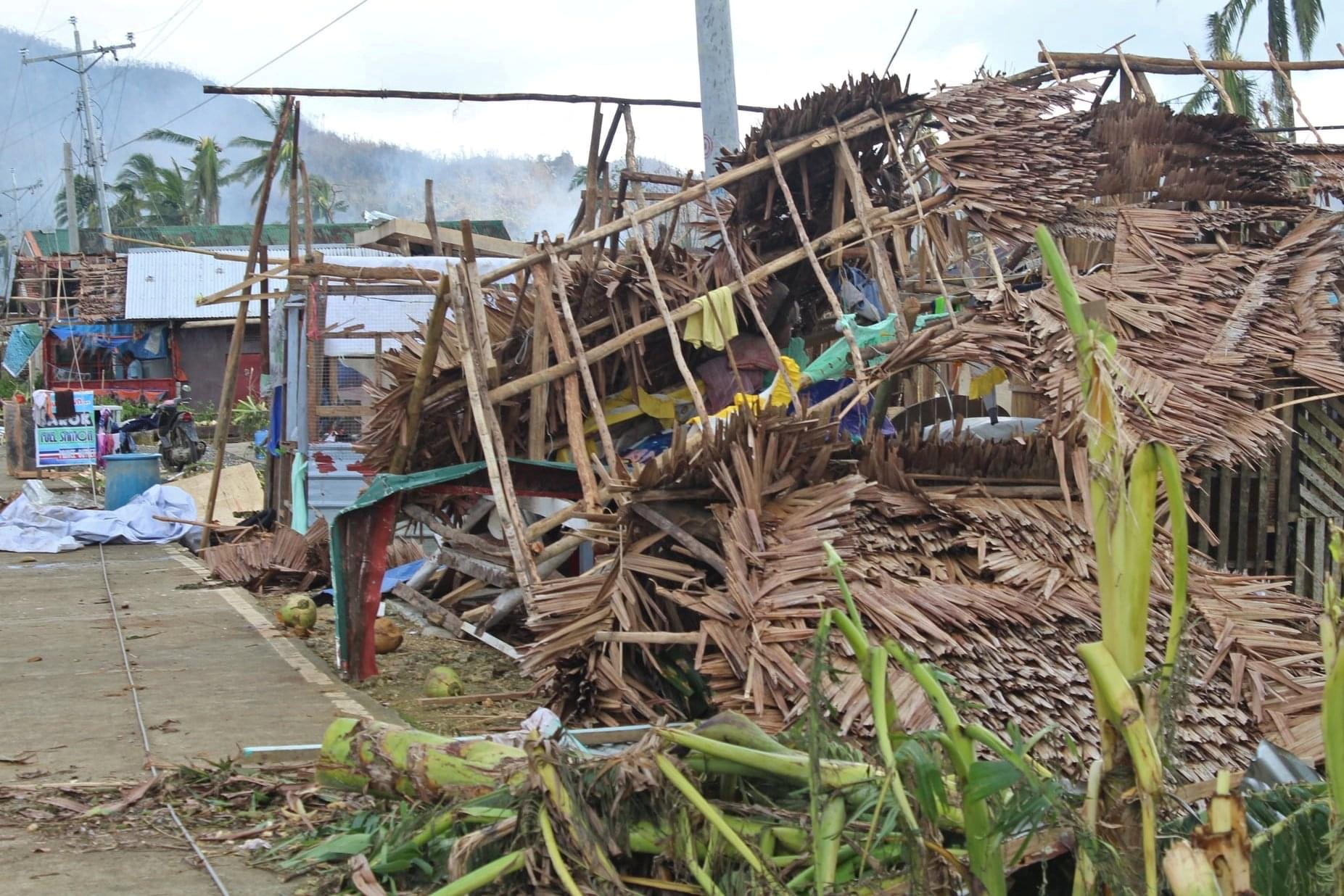 Houses damaged by Typhoon Rai in Surigao del Norte province, Philippines. Photo: Philippine Coast...