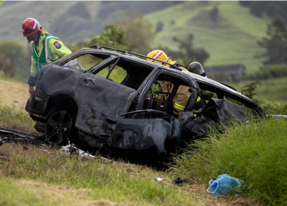 Emergency services at the car driven by Cheryl Te Maro. Photos: NZ Herald