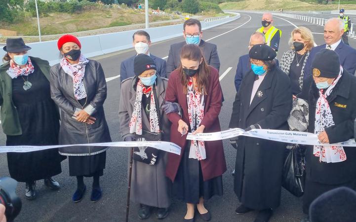 Prime Minister Jacinda Ardern cuts the ribbon during the Transmission Gully opening ceremony....