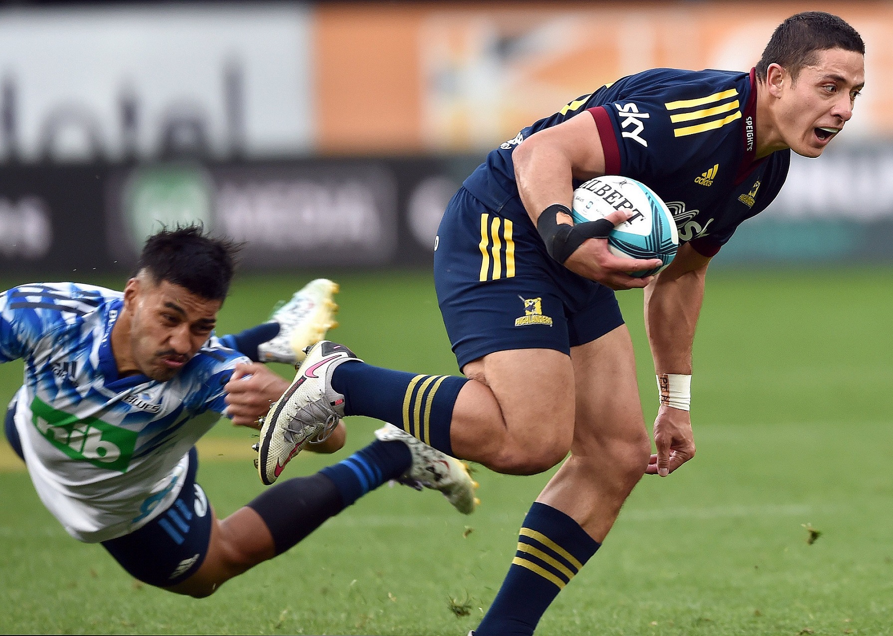 Highlander Freedom Vahakolo gets past the Blues’ Rieko Ioane during the 2022 Super Rugby Pacific...