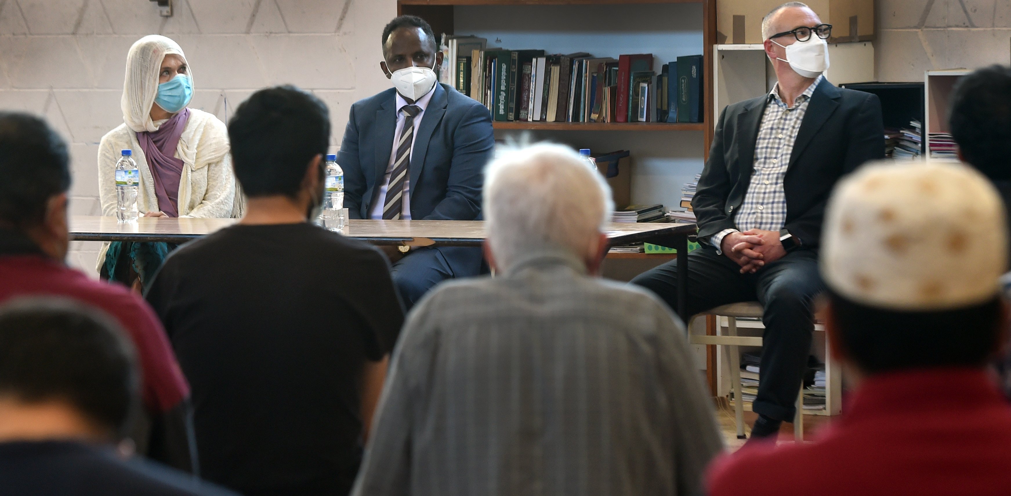 Members of Parliament (from left) Ingrid Leary, Ibrahim Omer and David Clark listen to members of...