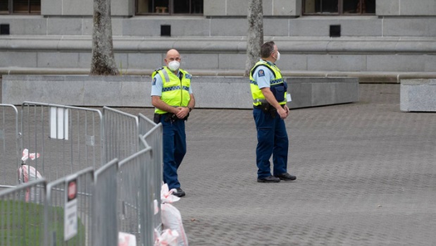 Police officers patrol Parliament grounds ahead of more planned protests in Wellington. Photo:...