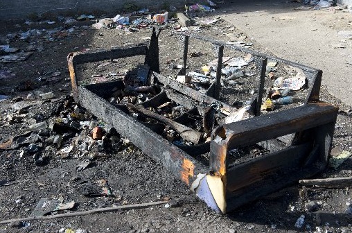 The charred carcass of a couch outside a Castle St flat on Sunday. PHOTO: GERARD O'BRIEN