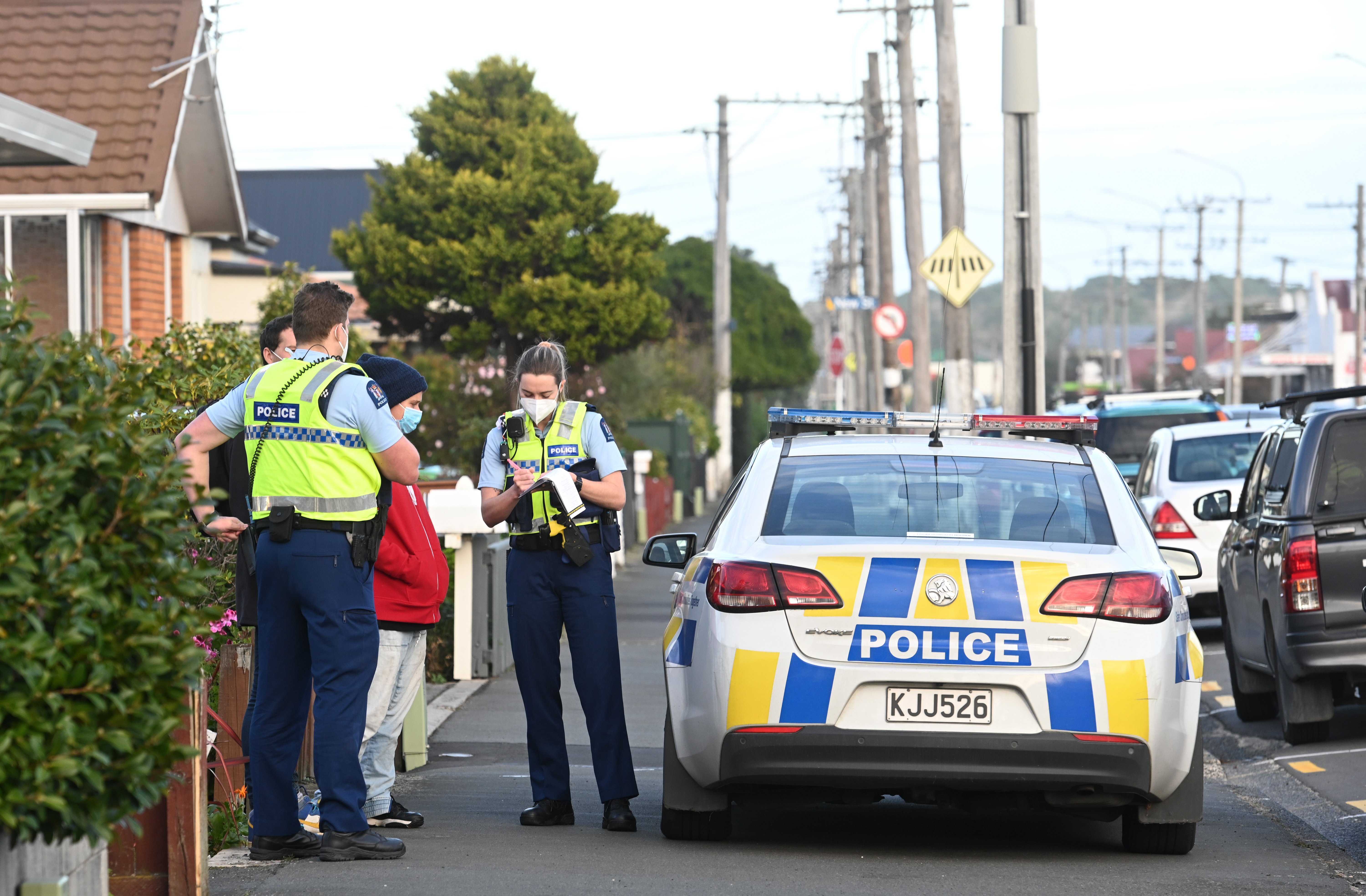 Police officers talk to Nadia Clarke and Marc Calvo who say they were nearly hit by a car on...