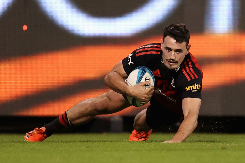 Will Jordan crosses to score for the Crusaders against the Brumbies. Photo: Getty Images