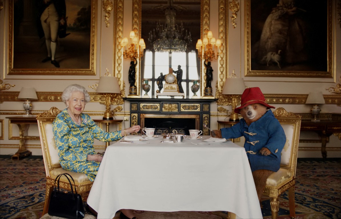 Queen Elizabeth and Paddington Bear have tea together at Buckingham Palace. Photo: Buckingham...