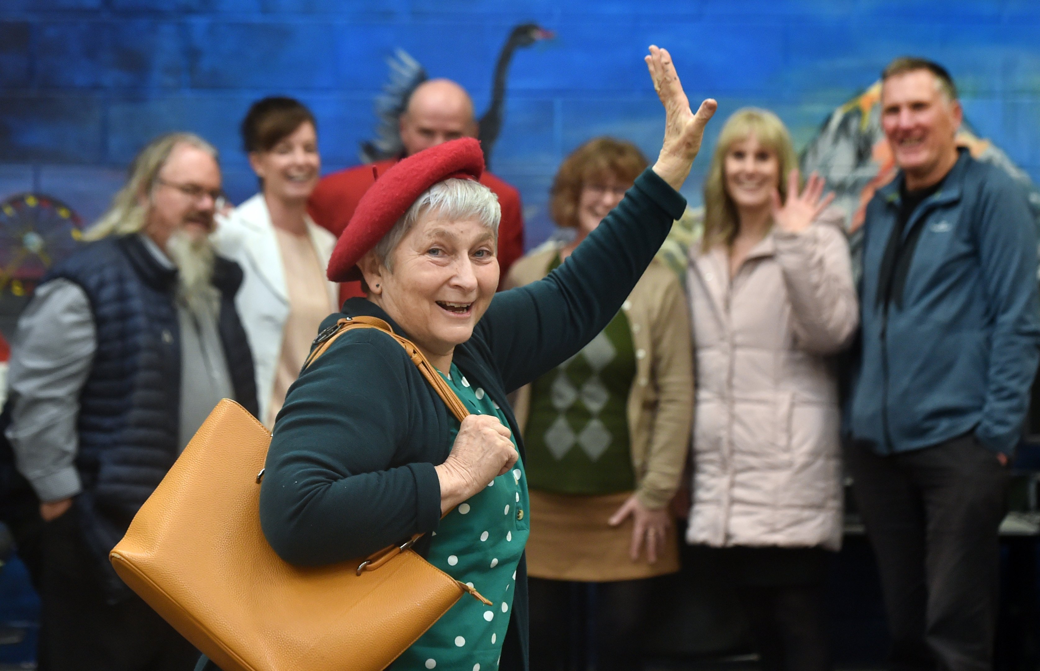 Retiring after 46 years at Logan Park High School, languages teacher Barbara Fitzsimons waves...