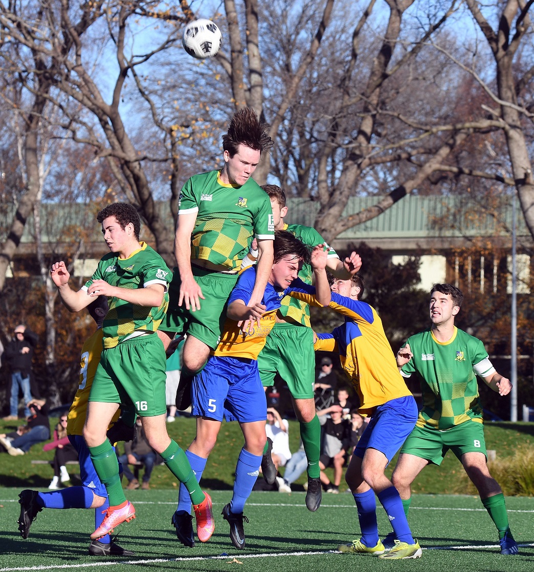 Alex Cox heads the ball for Green Island during a game earlier this month. PHOTO: STEPHEN JAQUIERY