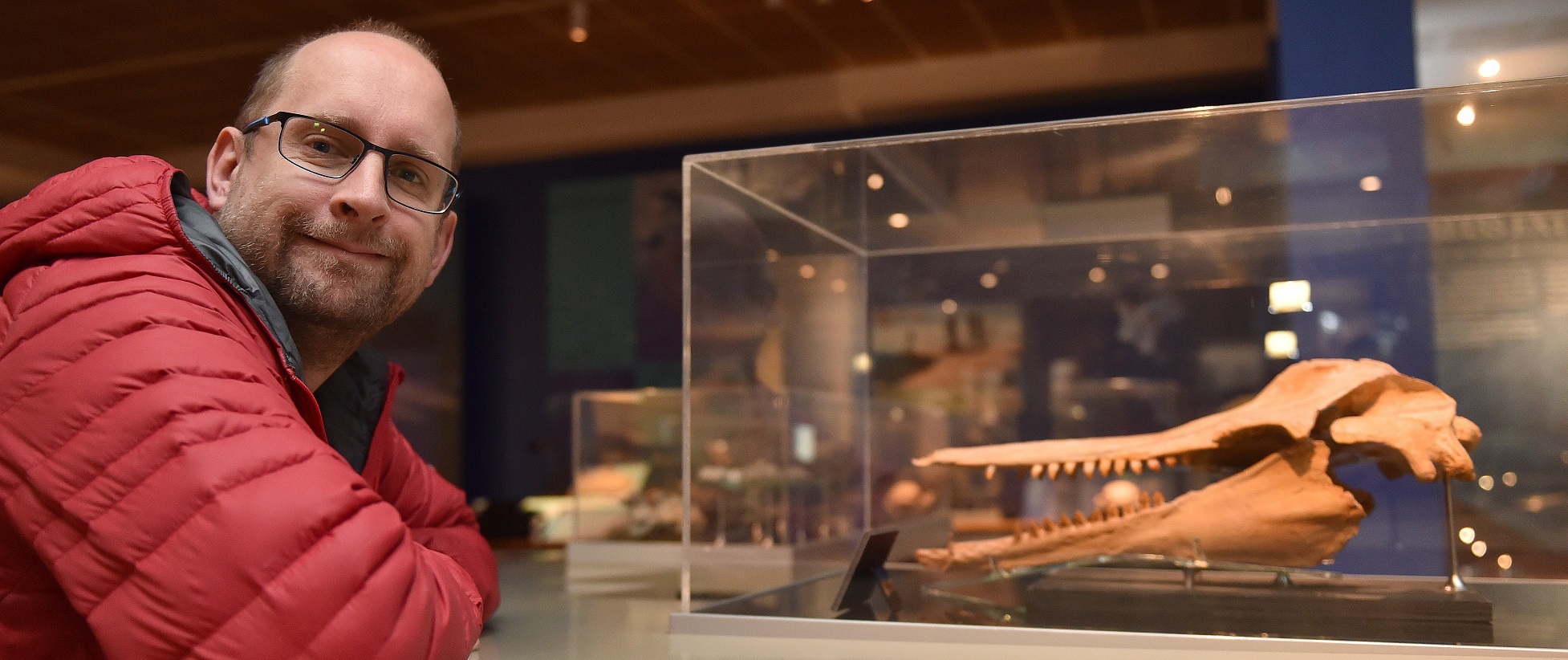 University of Otago paleogenetics laboratory director Dr Nic Rawlence with a 25 million-year-old...